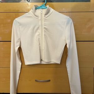 White long-sleeved crop top.